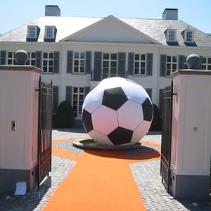 4m inflatable football outside in a courtyard
