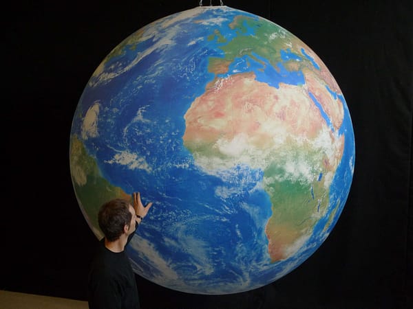 2m printed globe hanging in the studio